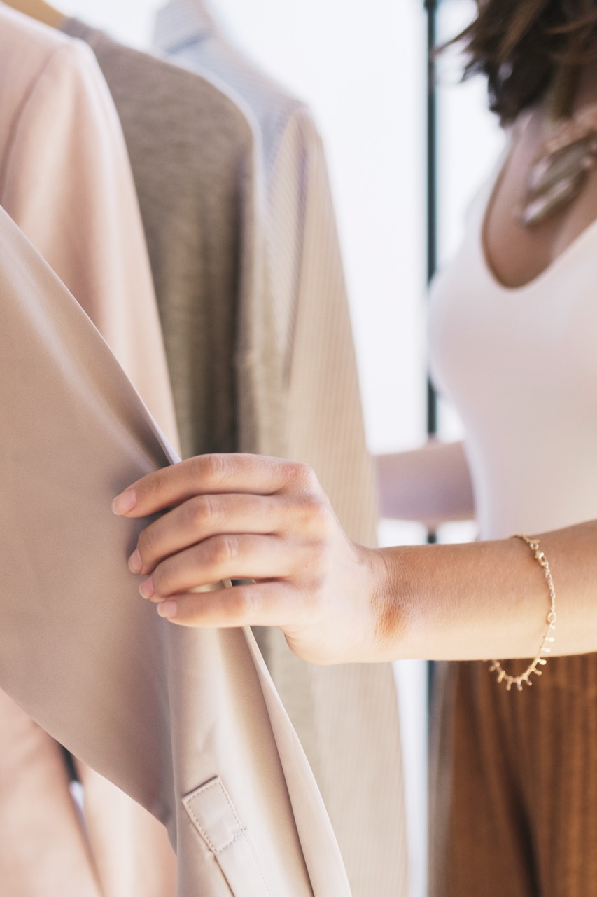 Fashion stylist working with clothes